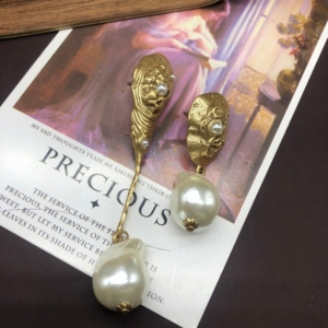 The Art of Asymmetry Mismatched Pearl Earrings Styling Guide